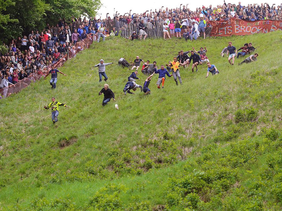 One of England’s quaintest traditional event is the cheese rolling competition.