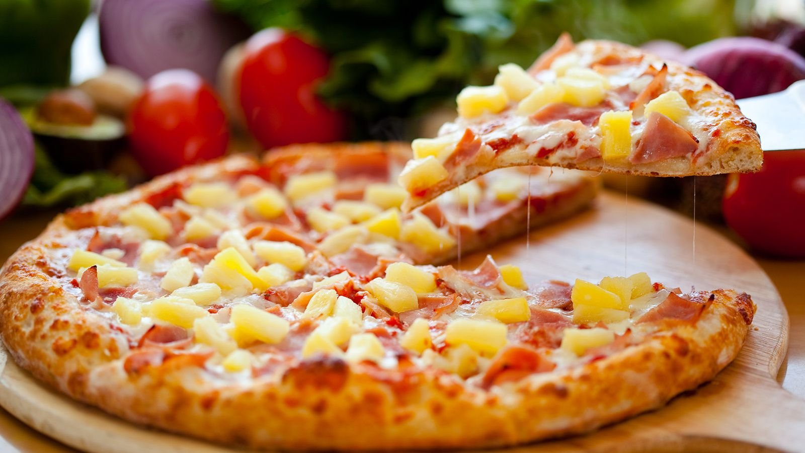The Hawaiian Pizza was invented by Sam Panopoulos in Canada & now it is most popular in Australia.